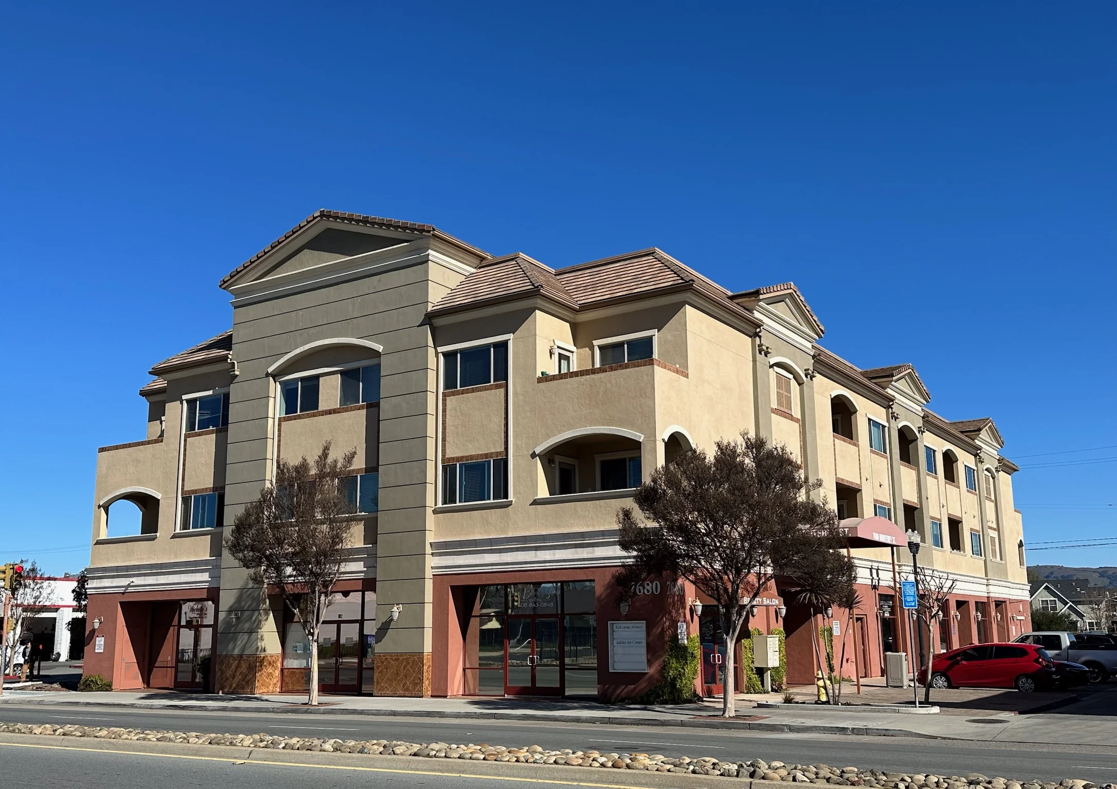Wide angle view of Monterey Terrace luxury apartment building in downtown Gilroy CA